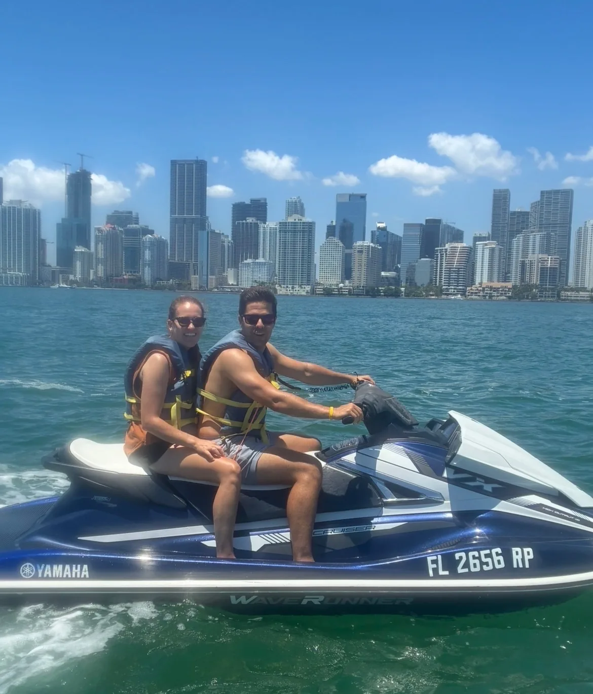 Couple on a Yamaha WaveRunner with Miami skyline in background
